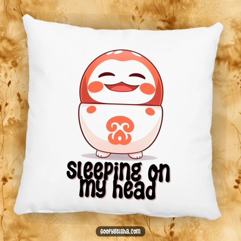 Funny pillow featuring a cute Daruma doll standing on its head with a cheerful grin, adding comfort and humor.