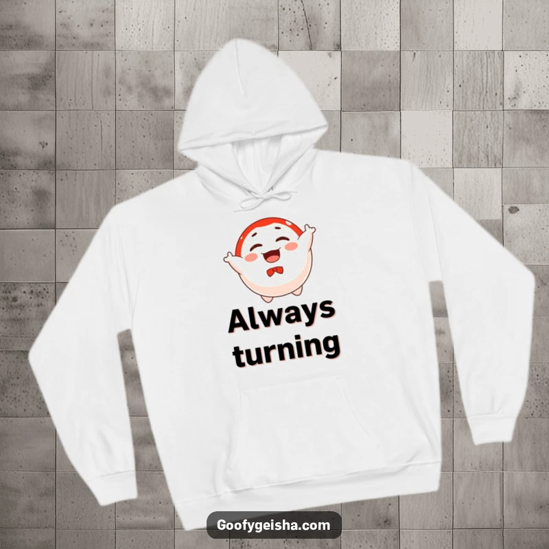 Funny hoodie featuring a floating Daruma doll character joyfully spinning, offering cozy warmth and a powerful dose of good luck.