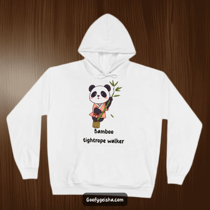 Funny hoodie with a small panda in a kimono struggling to balance on a bamboo stalk, a comical sight.