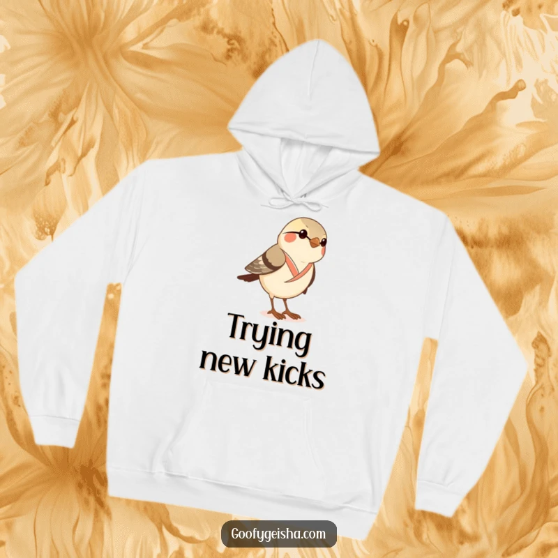 Funny hoodie with a curious sparrow in a dainty kimono attempting to wear geta sandals, showing determination and humor.