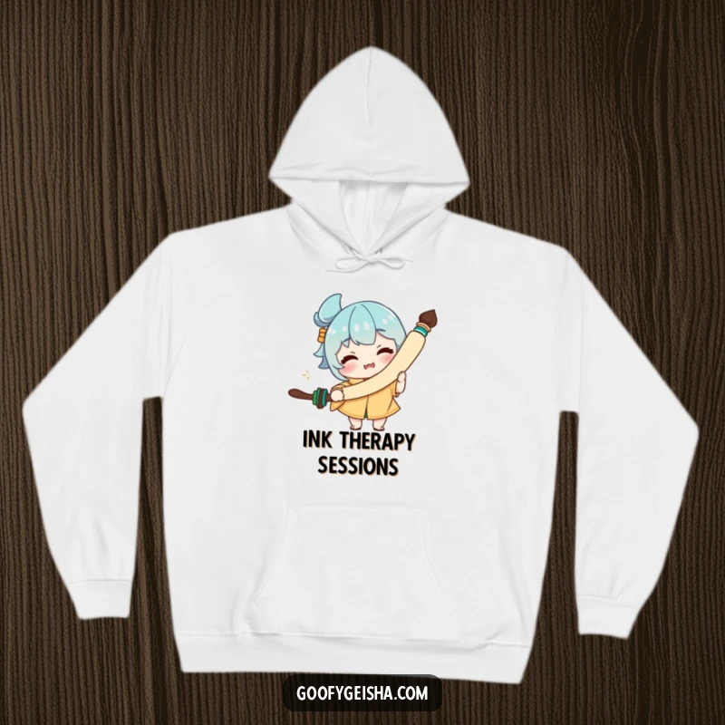 Funny hoodie depicting a character with a funny facial expression, holding a comically large calligraphy brush, perfect for art lovers.