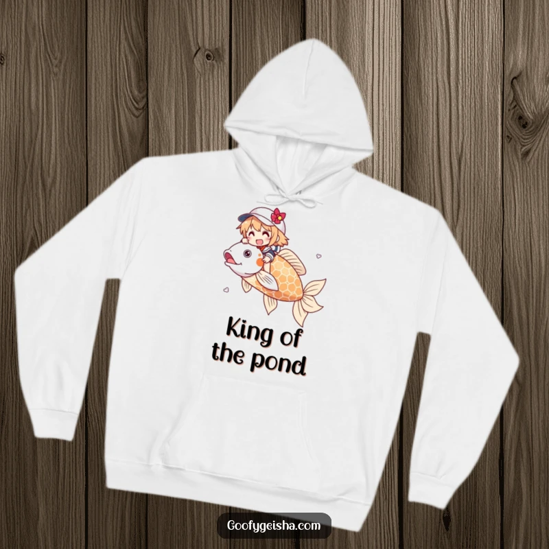 Funny hoodie illustrating a character gleefully riding a massive, ornate koi fish. Offers warmth and whimsical charm for everyday wear.