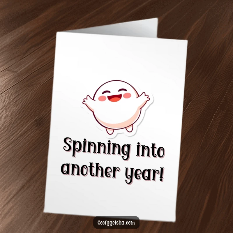 Funny Free Printable Birthday Card: A joyful Daruma doll spins wildly, spreading birthday cheer. A hilarious downloadable greeting for a print-at-home celebration.
