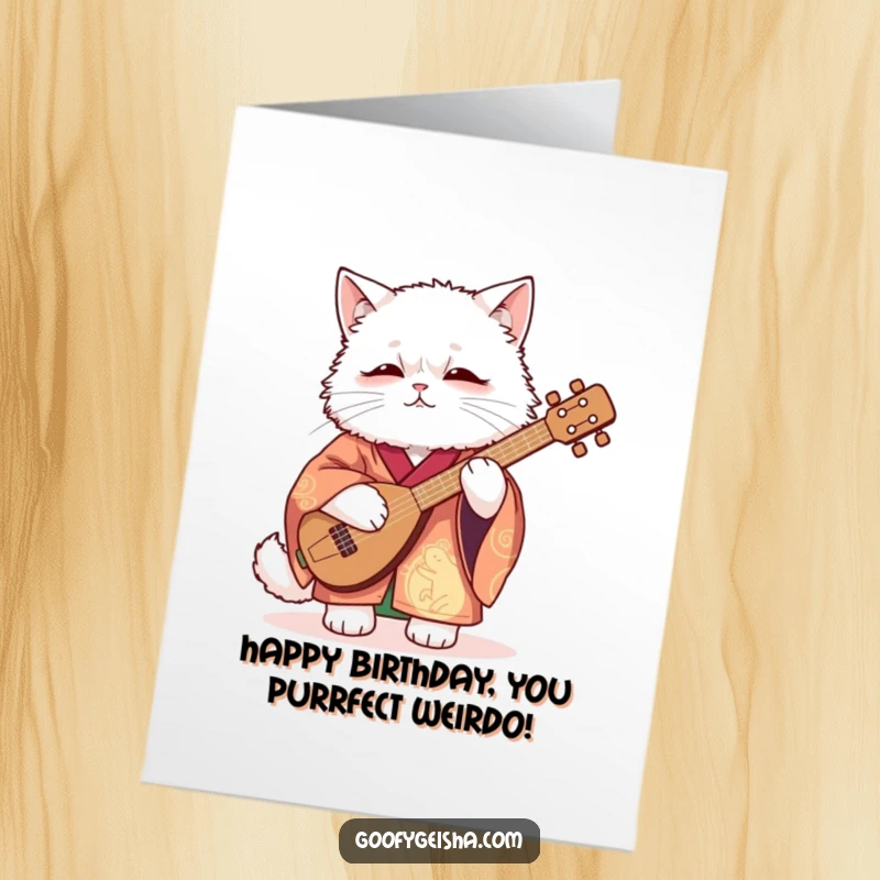 Funny free printable birthday card of a fluffy cat in a kimono awkwardly playing a shamisen, creating humorous musical chaos.