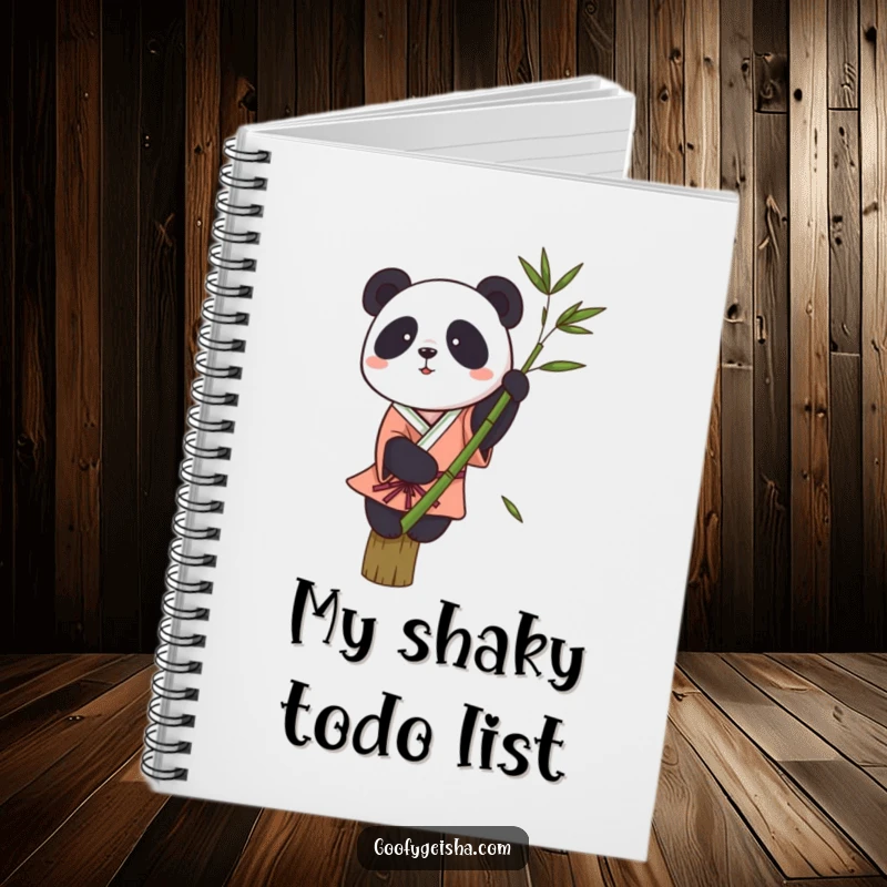 Funny notebook cover art: a small panda in a kimono attempting to balance on a single bamboo stalk, looking quite unsteady.