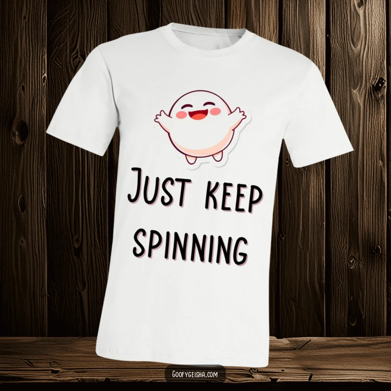 Funny spinning Daruma doll character T-shirt, capturing a moment of pure, joyful movement and whimsical fun.
