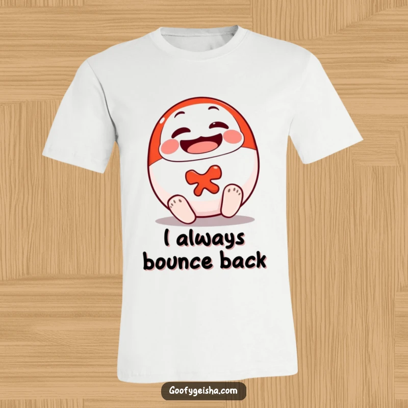 Funny Daruma Doll T-Shirt showing a cheerful doll character rolling onto its feet, representing determination and positive energy.
