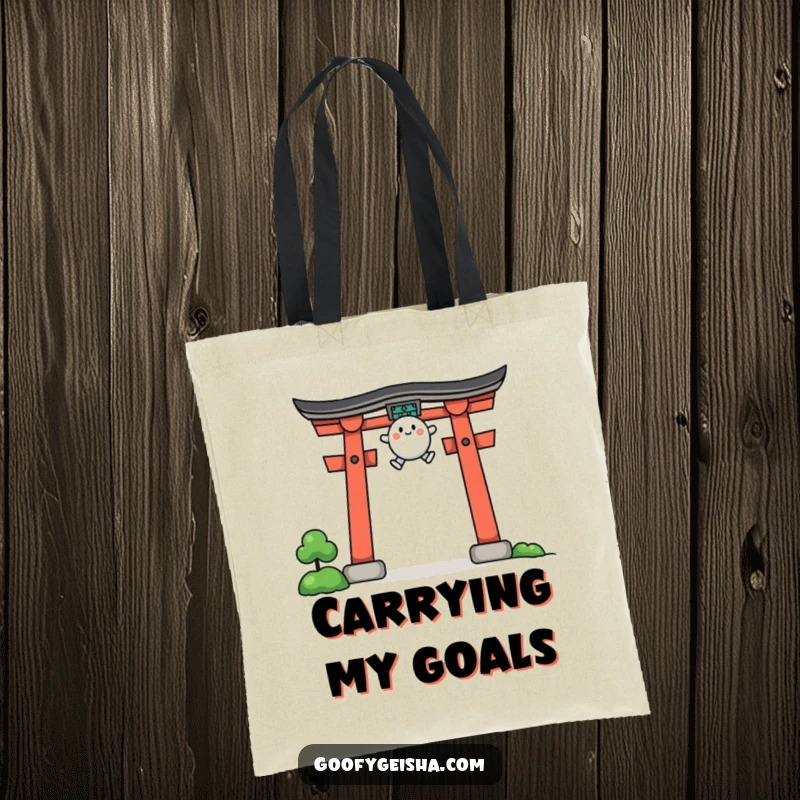 Funny tote bag featuring a small, rounded character in mid-jump over a stylized torii gate, ready for adventure.